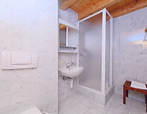 a room with a sink and a shower